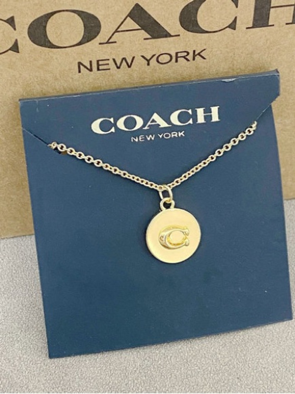 Coach Gold-Tone Logo Disc Necklace